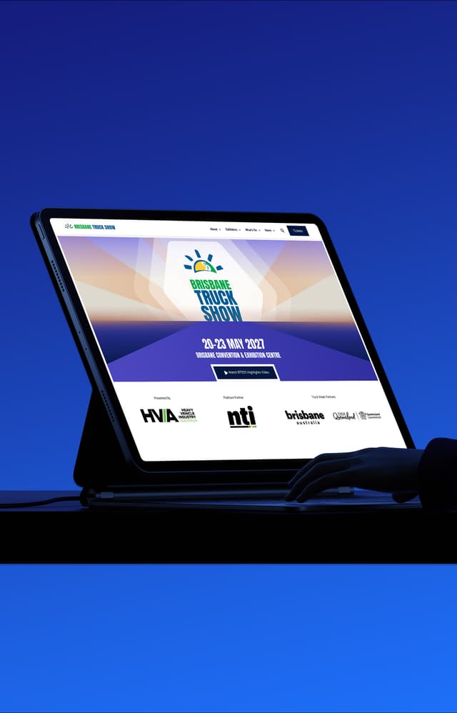 An iPad displays the Brisbane Truck Show website homepage with sponsor logos and event dates.