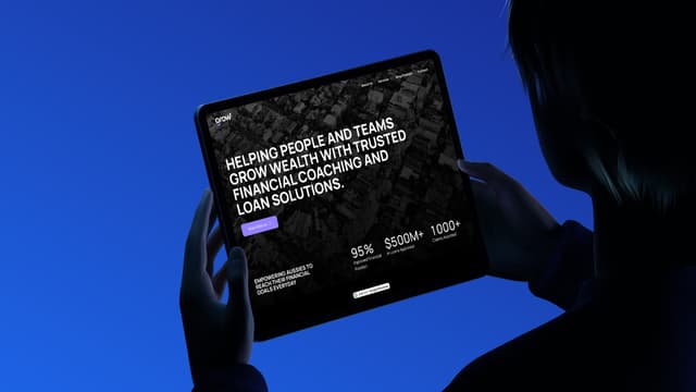 A silhouetted person holds a tablet displaying the Grow website homepage with its financial coaching hero banner.