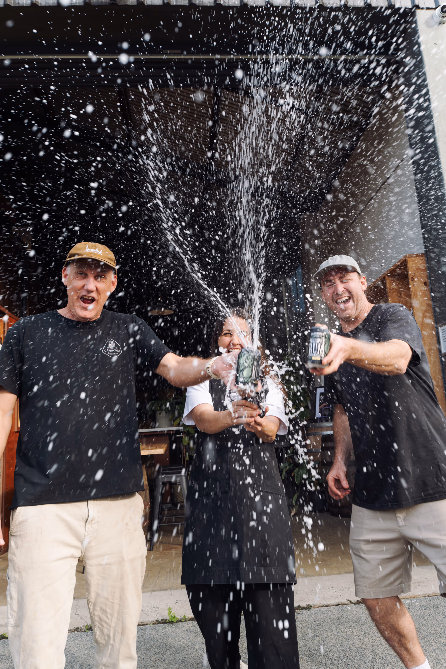 The Capricorn Distilling Co team celebrating in the distillery