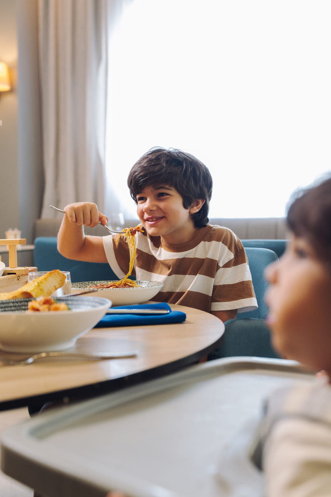 A child eating pasta in the Hilton Surfers Paradise restaurant